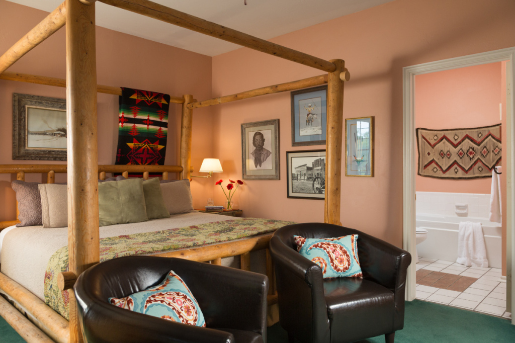 Chickasaw Rancher Room - Wall with photos including of Montford Johnson, Chairs, and Bathroom