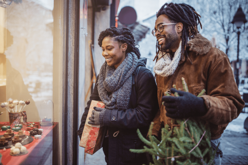 couple window shopping at christmas